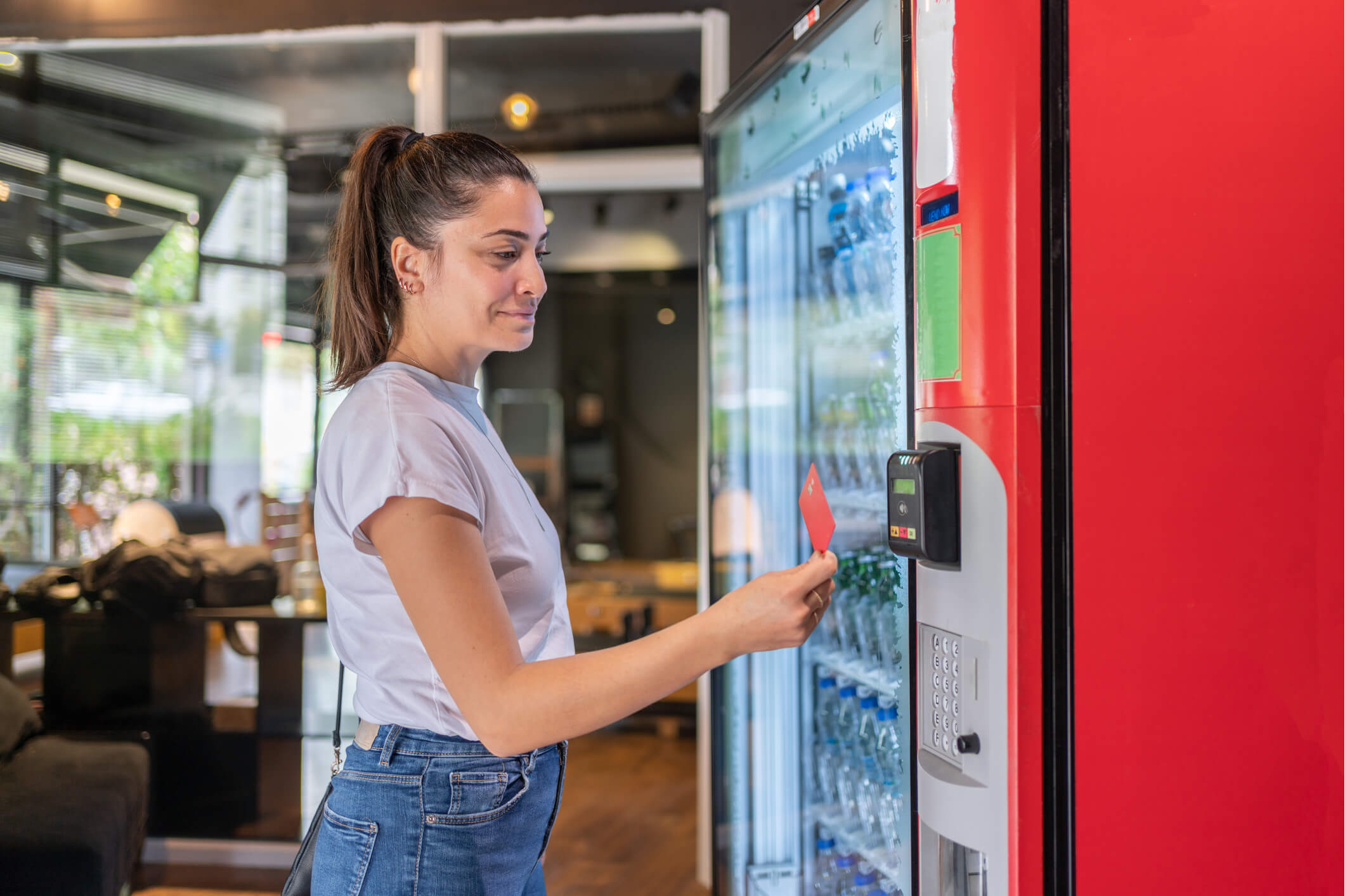 Person selecting drink from vending machine